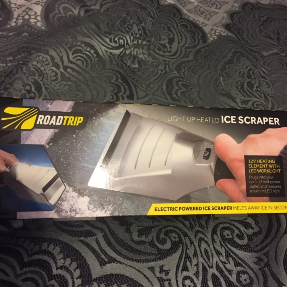 New in box heated ice scraper